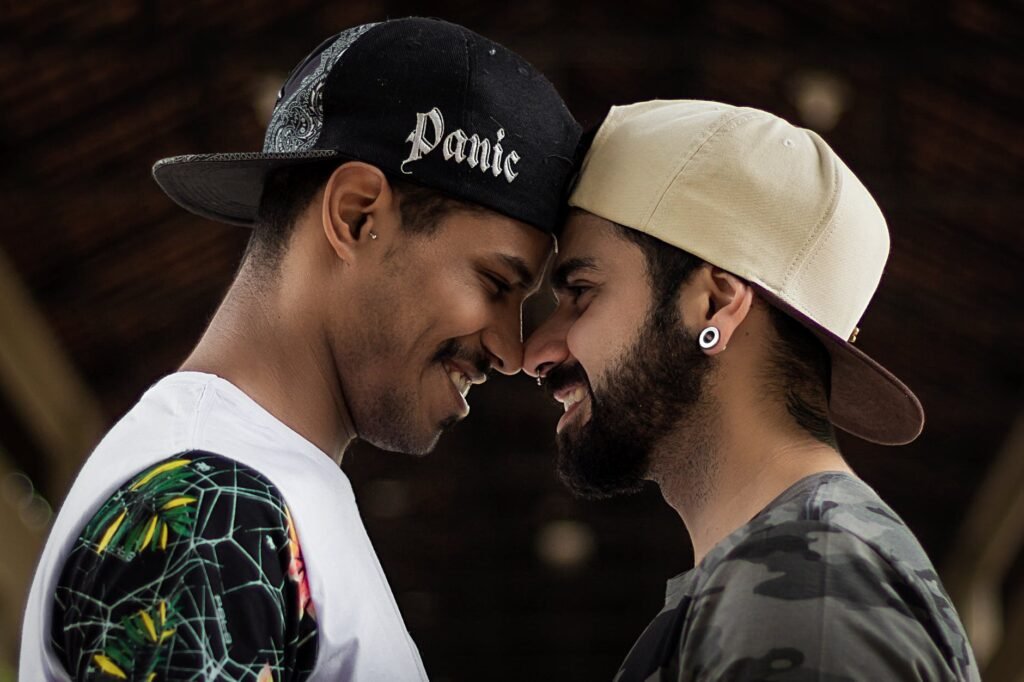 selective focus photography of two smiling men facing each other