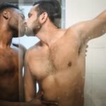 two men kissing in the shower